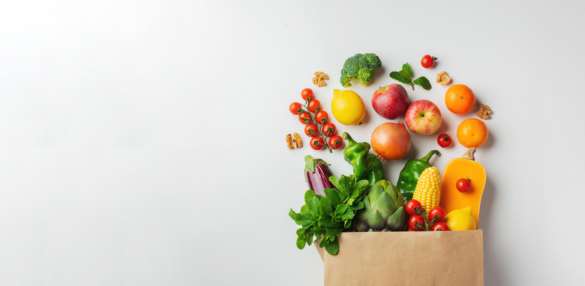 Delivery Healthy Food Background. Healthy Vegan Vegetarian Food in Paper Bag Vegetables and Fruits on White, Copy Space, Banner. Shopping Food Supermarket and Clean Vegan Eating Concept